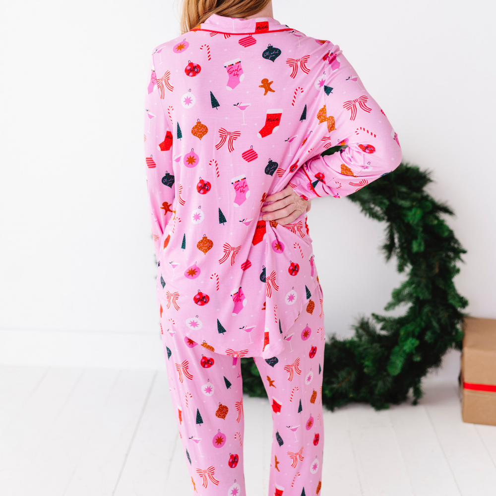 
                      
                        Woman in pink Christmas pajamas by Kiki and Lulu
                      
                    