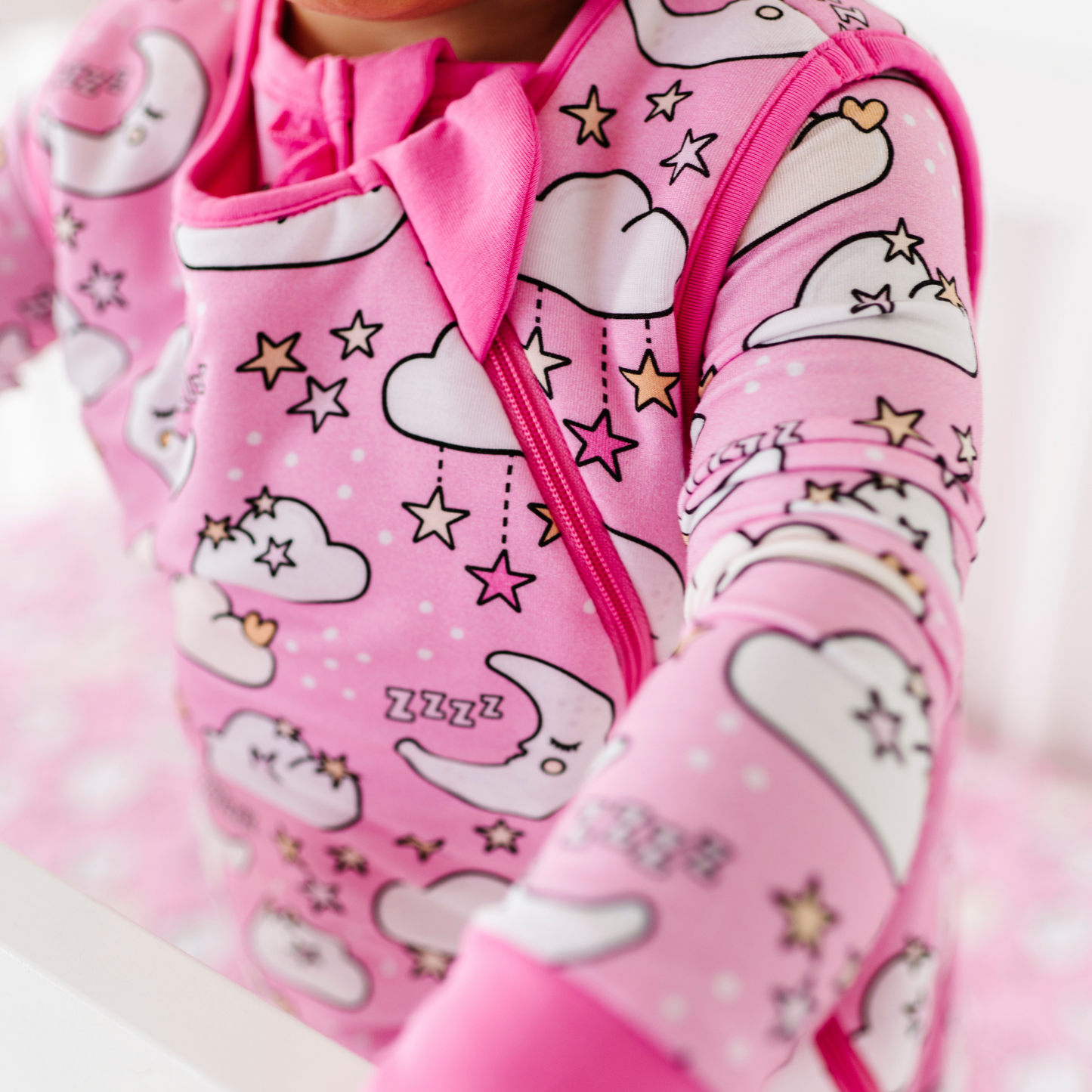 Baby in pink sleep bag by Kiki and Lulu