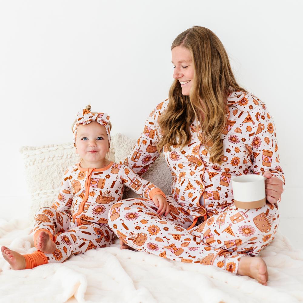 
                      
                        Baby in Pumpkin Spice Latte Pajamas by Kiki and Lulu
                      
                    