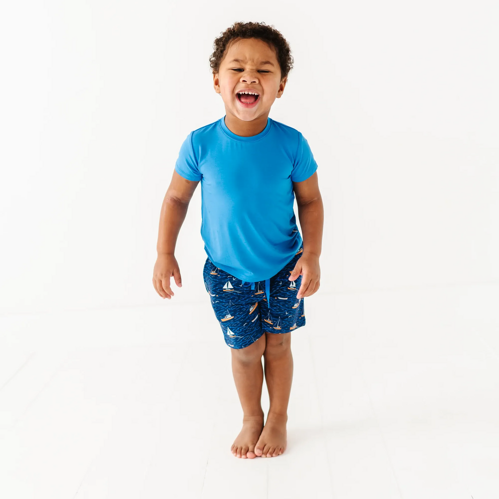 Boy in Sailboat shorts by Kiki and Lulu