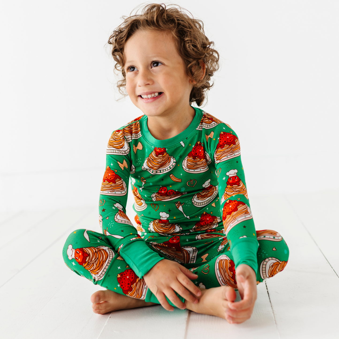 Boy wearing spaghetti pajamas by Kiki and Lulu