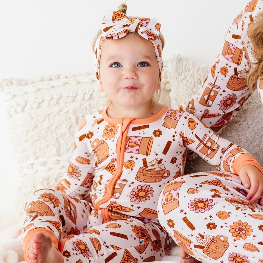 
                      
                        Baby wearing pumpkin spice latte bow
                      
                    